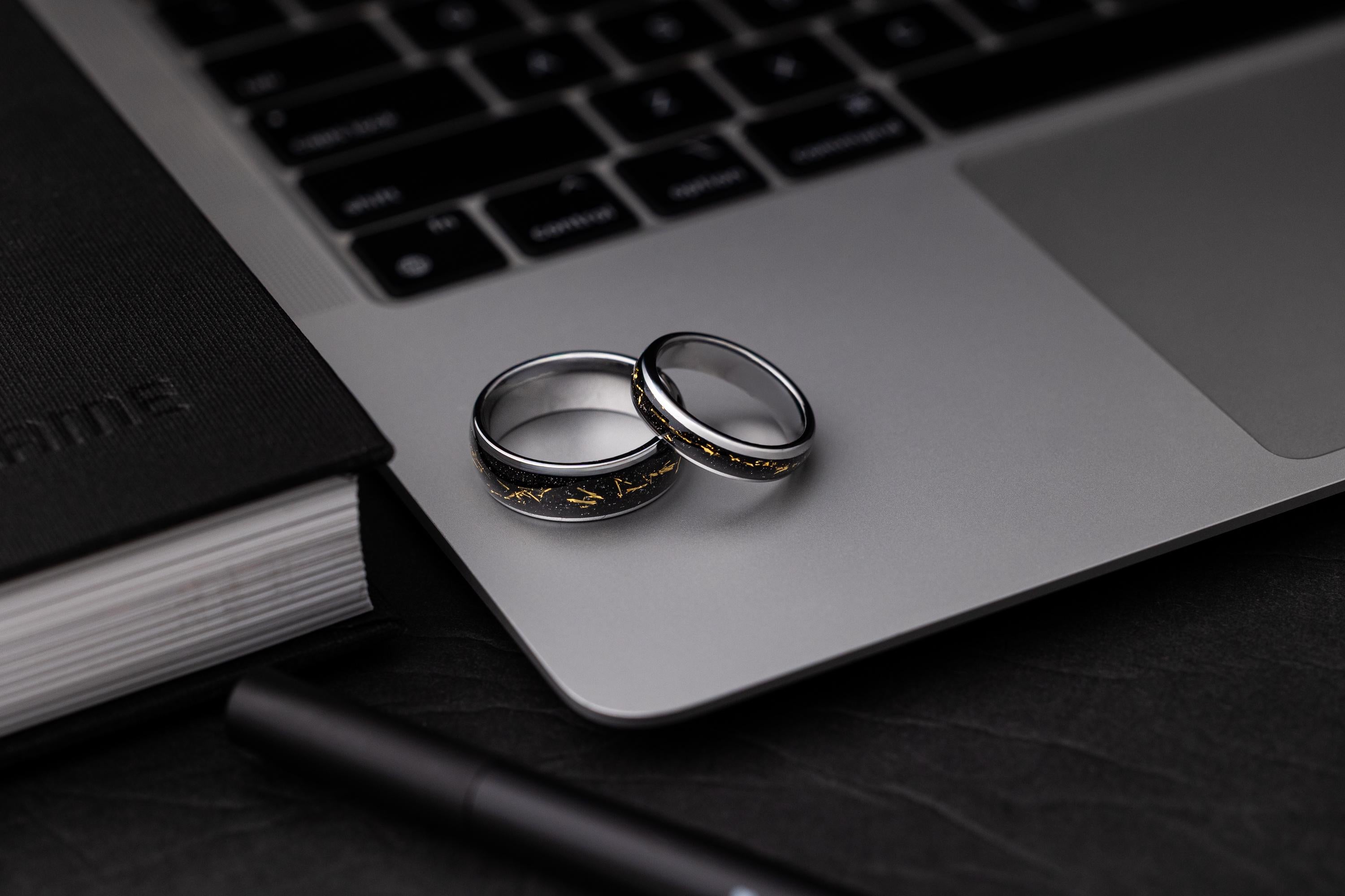Cosmic Galaxy Rings Wedding Set: Silver Band with Black Sand and Gold Foil